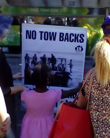 'No tow backs' sign made using a poster, 2015.