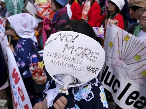 No! more Hiroshimas, handmade sign on fan, 2015.