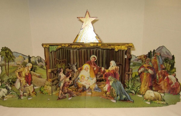  20th century with die cut cardboard nativity scene.